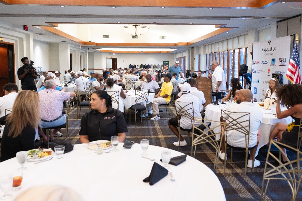 Guests seated at round tables in the banquet hall at Old Ranch Country Club during the awards dinner