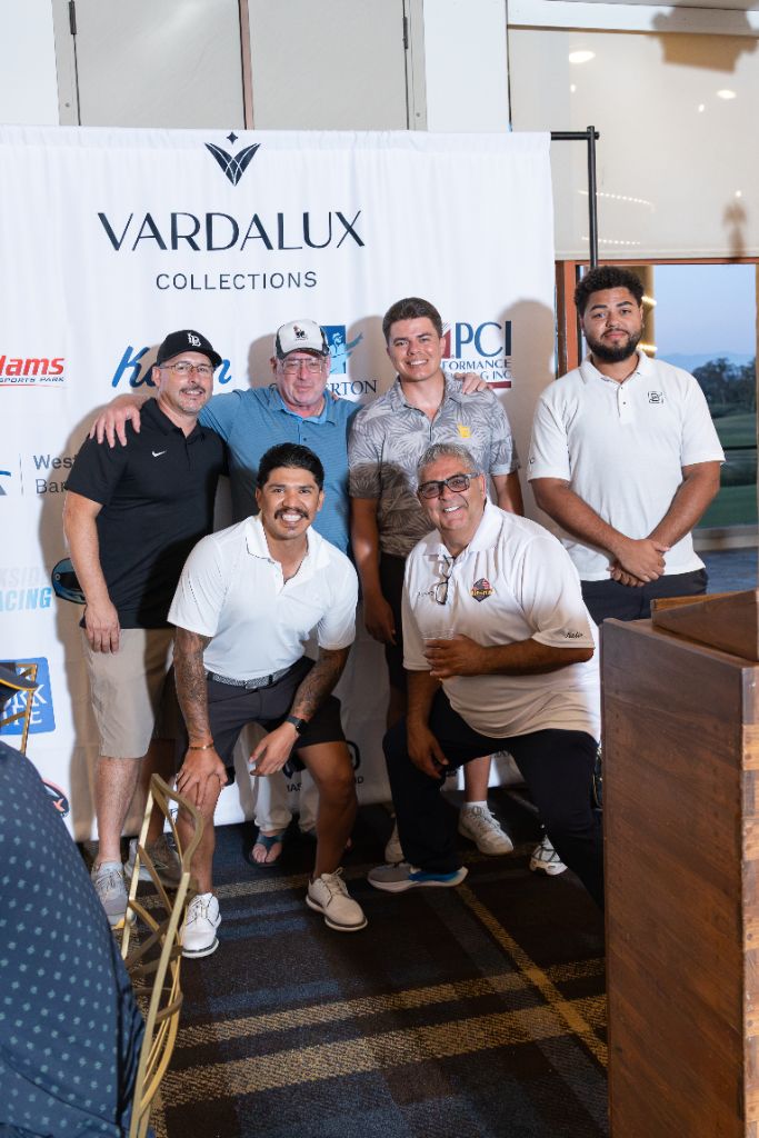 2nd Place team - Team Cal State Long Beach - posing in front of the Vardalux sponsor backdrop